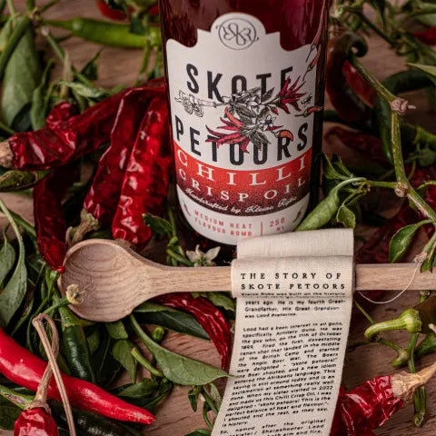 Skote Petoors Chilli Crisp Oil with a Wooden Spoon